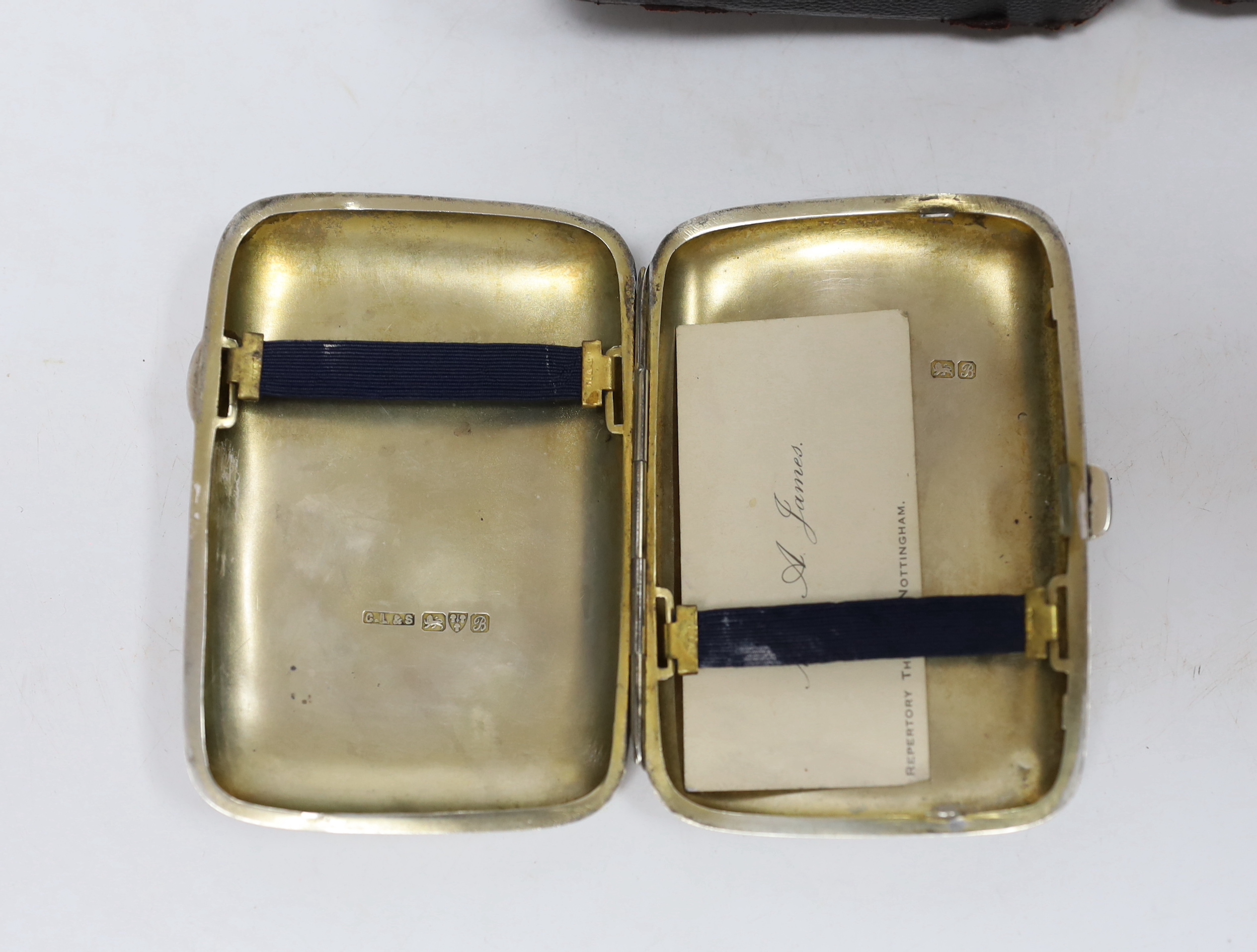 D’Oyly Carte interest; a cased silver cigarette case inscribed ‘To A.J. for hard work done from H.E.B. S. African Tour 1902-03, hallmarked Chester 1902, together with a signed Lindsay Harman, ‘A Comic Life’ and W.S. Gilb